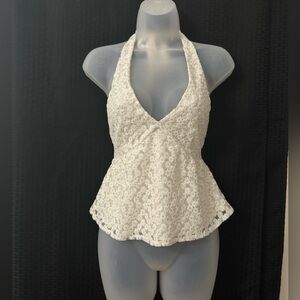 White halter top with floral embroidery and gold shimmer